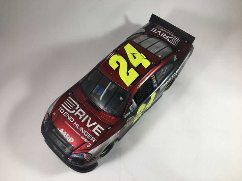 After all the tape, damage, and weathering was done, I applied a light coat of semi-gloss clear over the whole car.